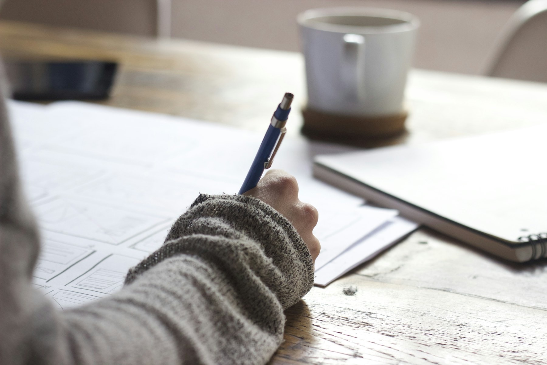 Student studying with notes and academic support